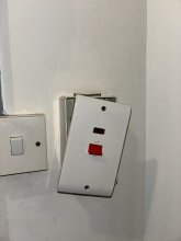 Old isolator, notice the crack around the neon light area indicating overheating.
