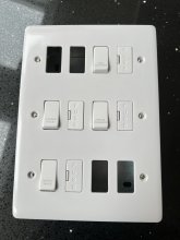 This is the appliance grid switch. The switches can be moved to different positions for convenience. I've laid them out in this picture to ensure I get the layout correct.
