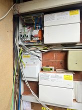 The original consumer unit was removed, the new one fixed in place. Here I'm arranging the cabling to be connected to the new consumer unit.